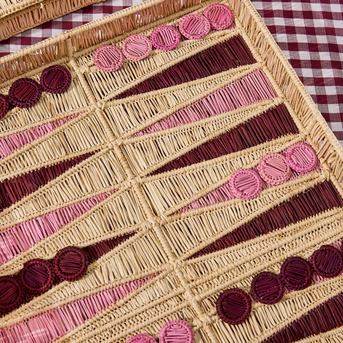 Handwoven backgammon board in natural and pink palm fibers